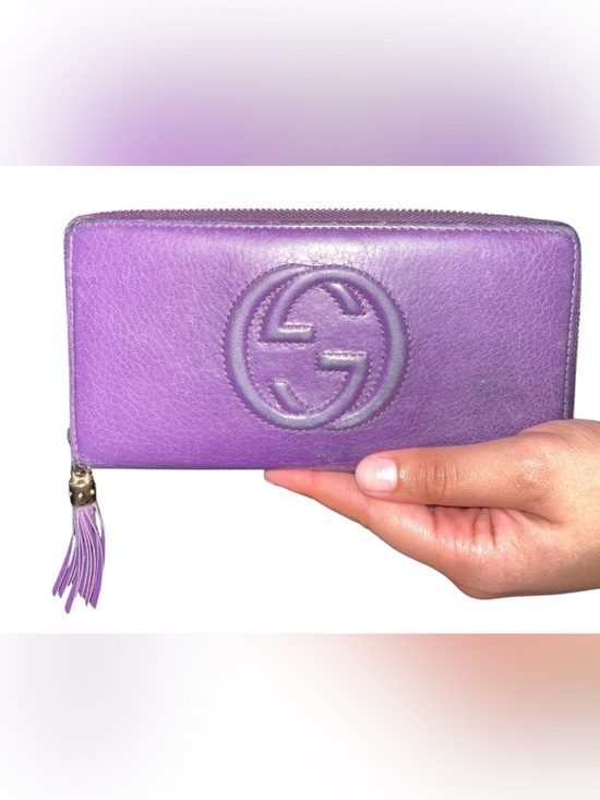 Gucci Handbags - Gucci Purple Embossed Leather Zip Wallet